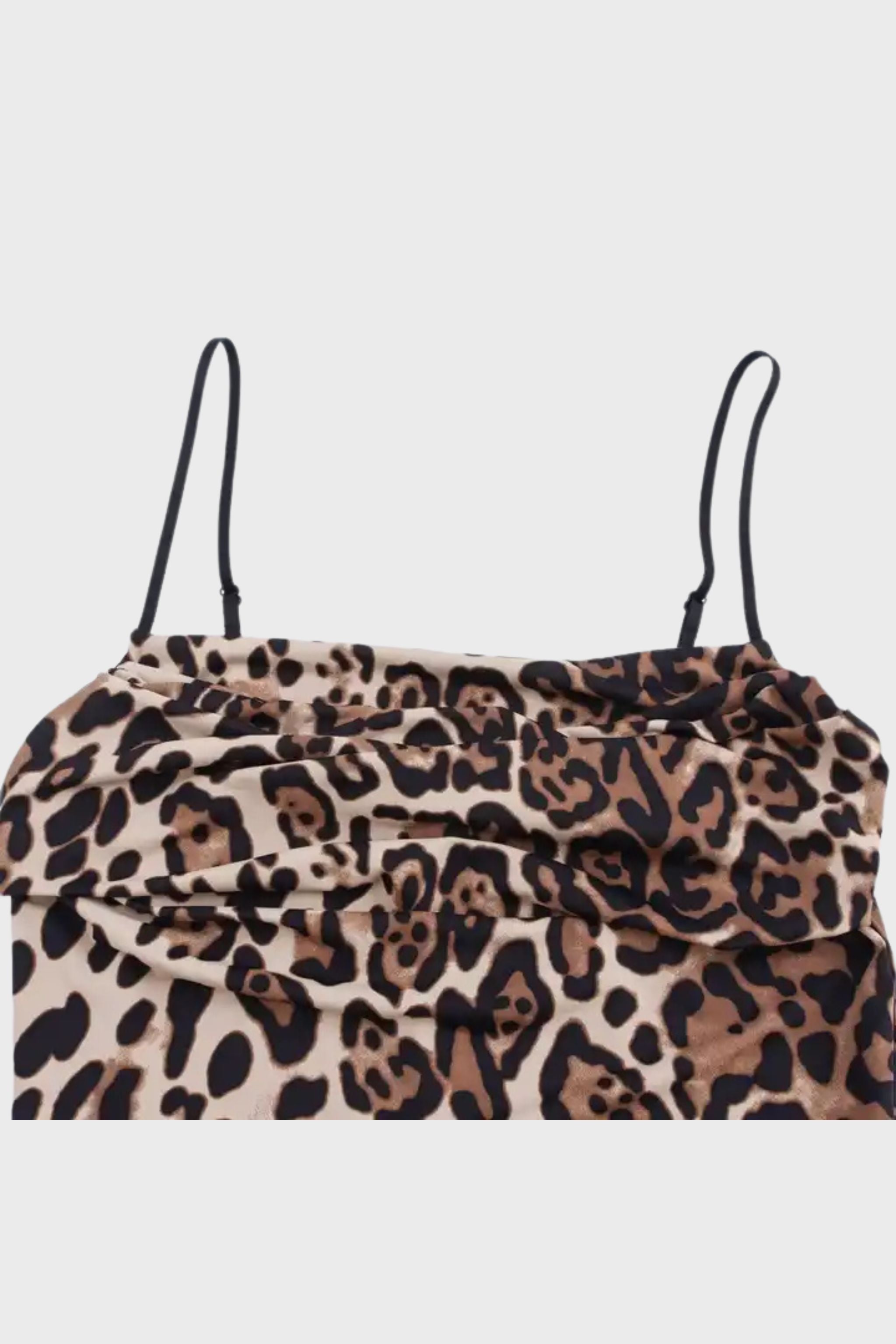 Close up of the Vela bodysuit, in the color 'Leopard'.